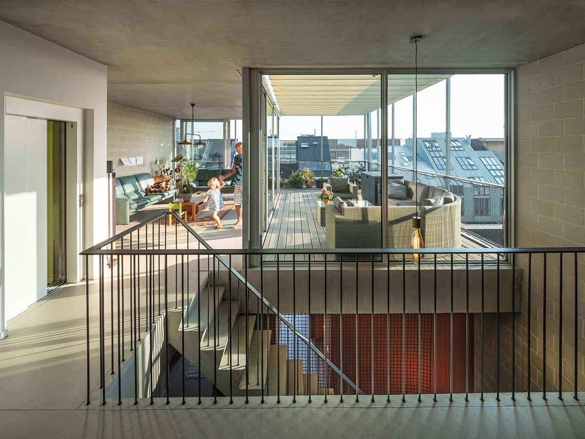 interior living room with roof terrace of three generation house by BETA Architect Amsterdam