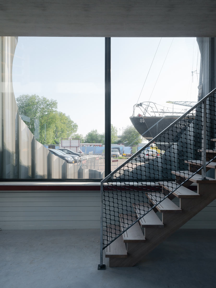 interior photo showing how stairs fold around cirrcular window perforation by BETA architects Evert Klinkenberg Auguste Gus van Oppen