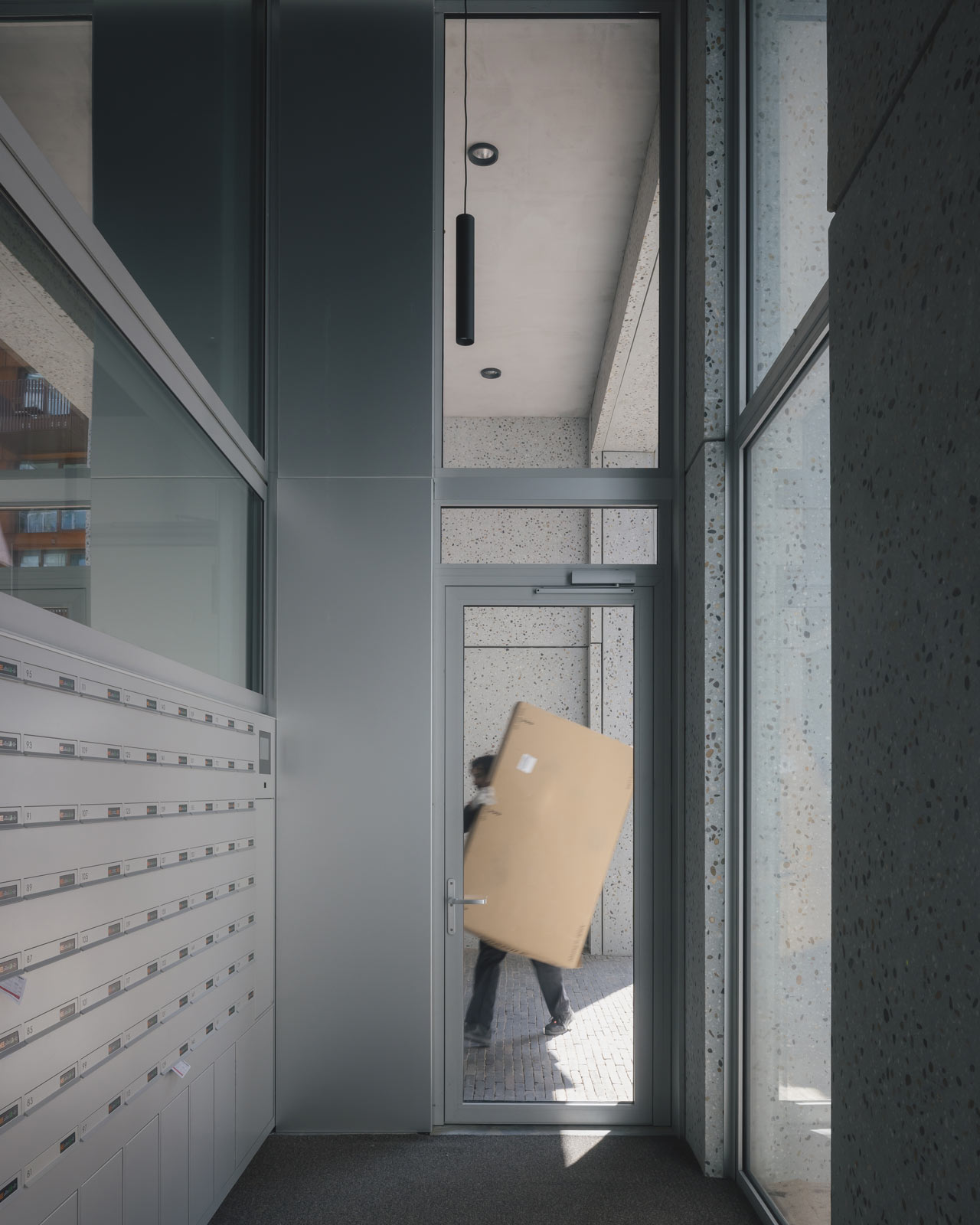 interior photo of mail room of Oostenburg apartment block Draaier by BETA architect amsterdam evert klinkenberg gus auguste van oppen image by Stijn Bollaert