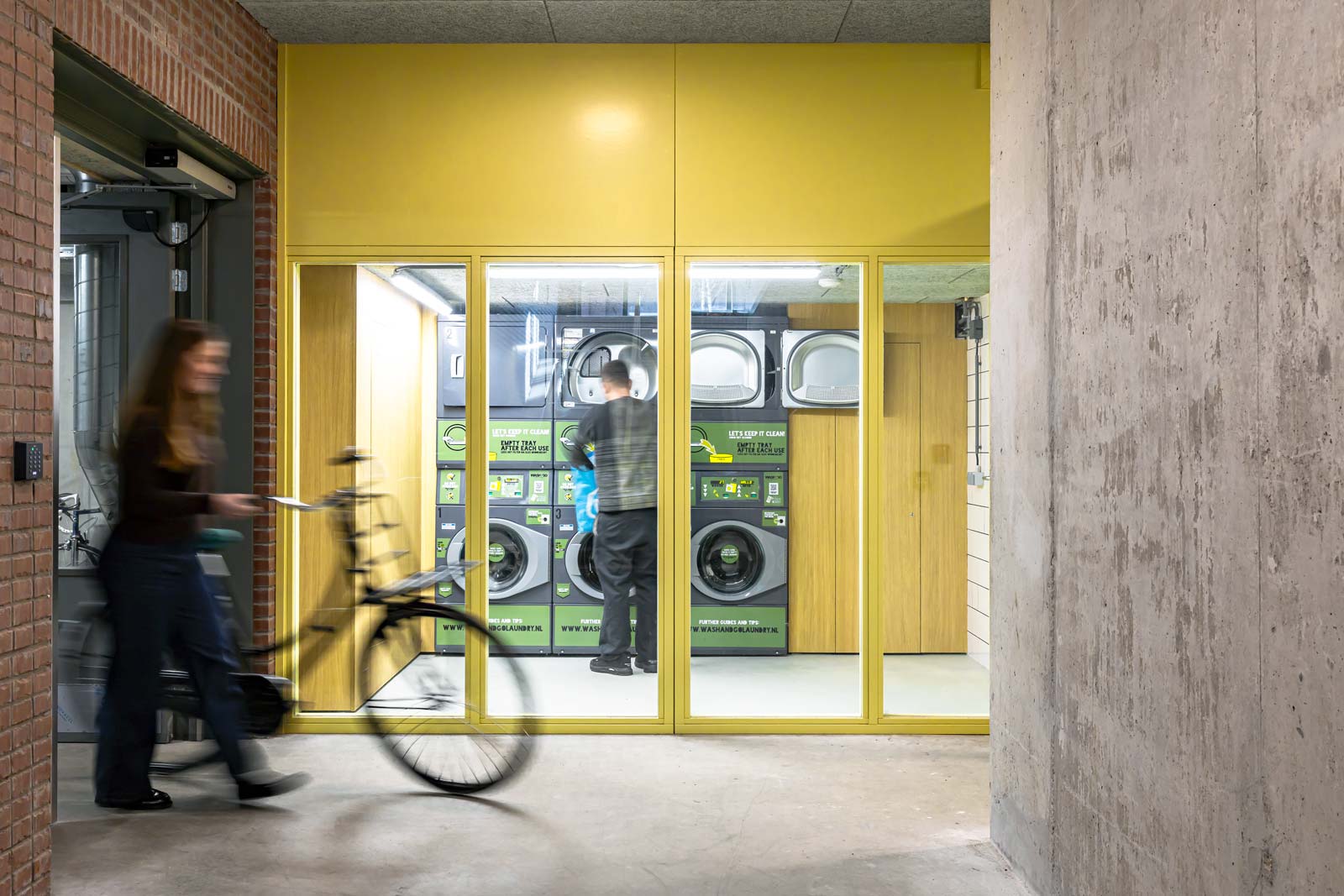 click to enlarge and start slideshow interior photograph of bike parking and collective laundrette at Wisselspoor project by BETA architects Amsterdam Evert Klinkenberg Auguste Gus van Oppen image by Sebastiaan van Damme